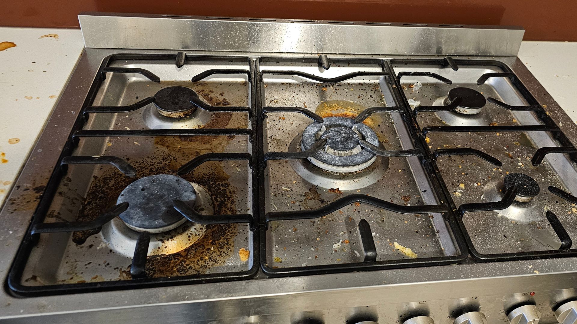 End of Lease Cleaning BEFORE Dirty kitchen surfaces and stained floors before a professional bond clean by Atto Property Cleaning in Melbourne.